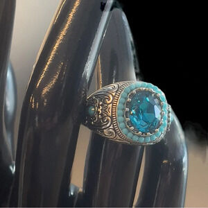 Southwestern style Ring with a blue main stone and light blue beads surrounding